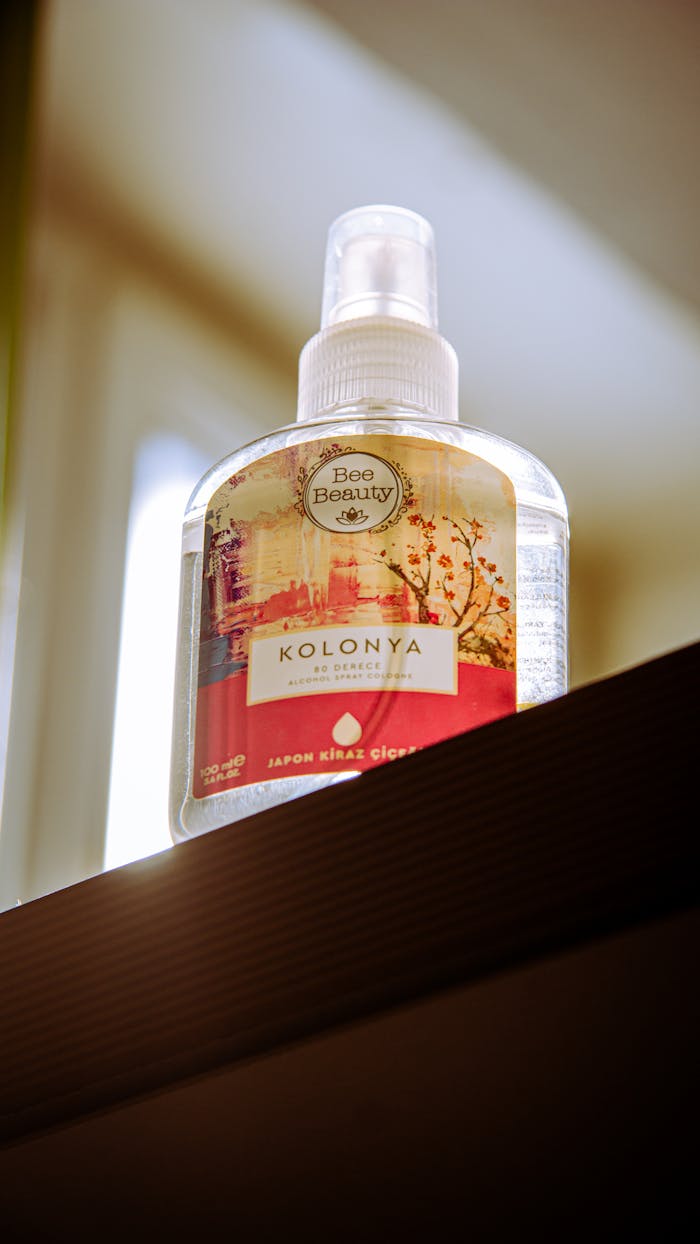 Close-up of a Kolonya fragrance bottle on a shelf with elegant design.